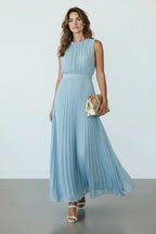 Close-up front view of the pleated bodice and cinched waist detail on the dusty blue sleeveless maxi dress